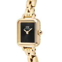 Close-up of the Quadro Mini Arch 3-link Onyx Sunray Gold women’s watch, featuring a rectangular black dial, minimalist gold hands, and a polished gold 3-link bracelet.