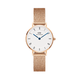 Rose gold petite women’s watch with white Roman numeral dial, blue hands, and mesh strap by Daniel Wellington.