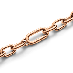 Detail of the Crystal Link Bracelet Rose Gold showing the polished rose gold chain links and the secure spring gate clasp with subtle branding.