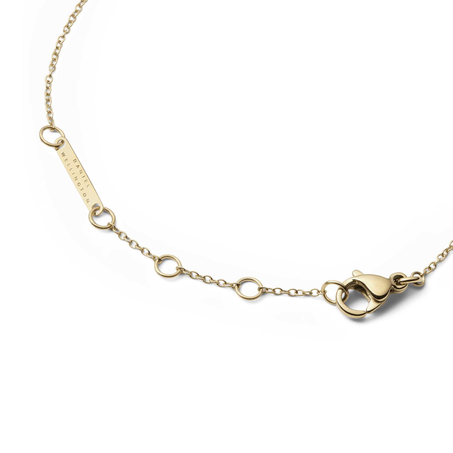 Detail of the Audrey Bracelet Black Agathe Gold showing the adjustable gold chain, secure lobster clasp, and engraved Daniel Wellington tag.