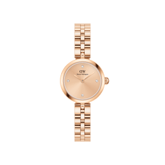 Rose gold Daniel Wellington women’s watch featuring a minimalist round dial with four crystal hour markers and a polished three-link bracelet.