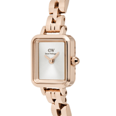 Close-up of the Quadro Mini Arch 3-link White Sunray Rose Gold watch, showing its rectangular silver-white sunray dial, minimalist face, and polished rose gold-plated stainless steel bracelet.