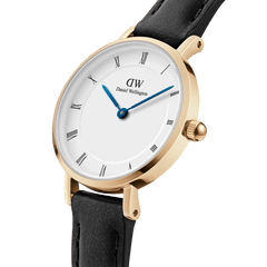 Petite Roman Numerals Sheffield Gold watch with gold case, white Roman numeral dial, blue hands, and black leather strap.