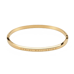 Classic Bangle Gold by Daniel Wellington, featuring a polished gold PVD finish, minimalist silhouette, and subtle engraved branding for a refined, timeless look.