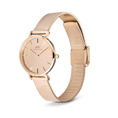 Petite Reflection Rose Gold women’s watch with a mirror glass dial, minimalist round face, and an adjustable rose gold mesh strap with a secure clasp.