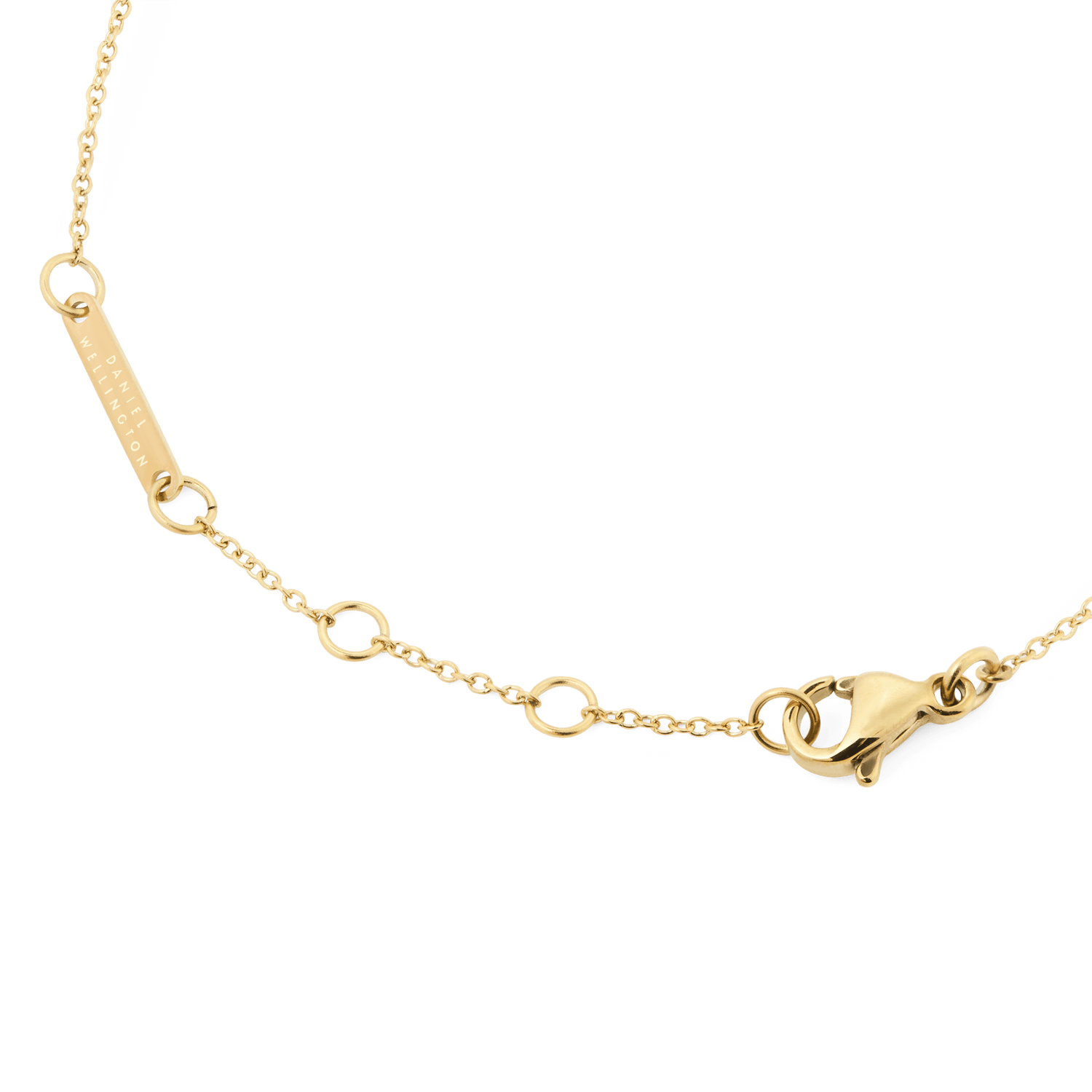 Detail of the Mirelle Heart Bracelet Gold showing the adjustable gold chain, secure lobster clasp, and Daniel Wellington engraved tag.