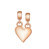 Rose gold broken heart charm with a polished finish, featuring an organic wave split and two separate loops for versatile styling on necklaces or bracelets.