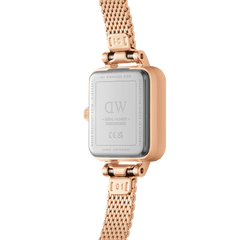Rear view of the Quadro Mini Melrose watch showing its stainless steel case back, rose gold mesh strap, and engraved Daniel Wellington branding.