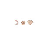 Set of three rose gold stud earrings featuring a crystal-embellished crescent moon, a delicate flower, and a smooth heart, each designed with a refined, minimalist finish.
