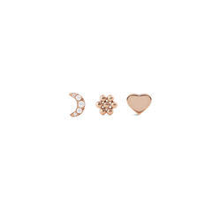 Set of three rose gold stud earrings featuring a crystal-embellished crescent moon, a delicate flower, and a smooth heart, each designed with a refined, minimalist finish.