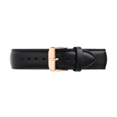 Black leather watch strap with a tapered design, detailed stitching, and a rose gold PVD-plated stainless steel pin buckle engraved with the Daniel Wellington logo. The strap features a smooth, supple finish and a quick-release connector for easy attachment.