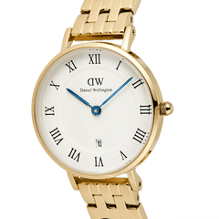 Close-up of the Petite Roman Numerals Date 5-link Gold watch, showcasing its gold five-link bracelet, white guilloché dial with black Roman numerals, blue hands, and date display at 6 o’clock.