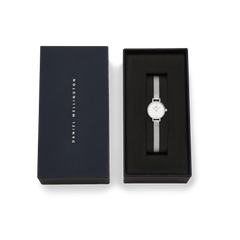 Petite Mini Sterling women’s silver watch with mesh strap presented in a navy Daniel Wellington gift box.
