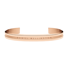 Rose gold Daniel Wellington Elan Bracelet featuring a polished open cuff design with engraved branding and minimalist styling.
