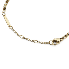 Close-up of the Classic Tennis Bracelet Honey Combo Gold, highlighting the adjustable gold chain, secure lobster clasp, and engraved Daniel Wellington tag.