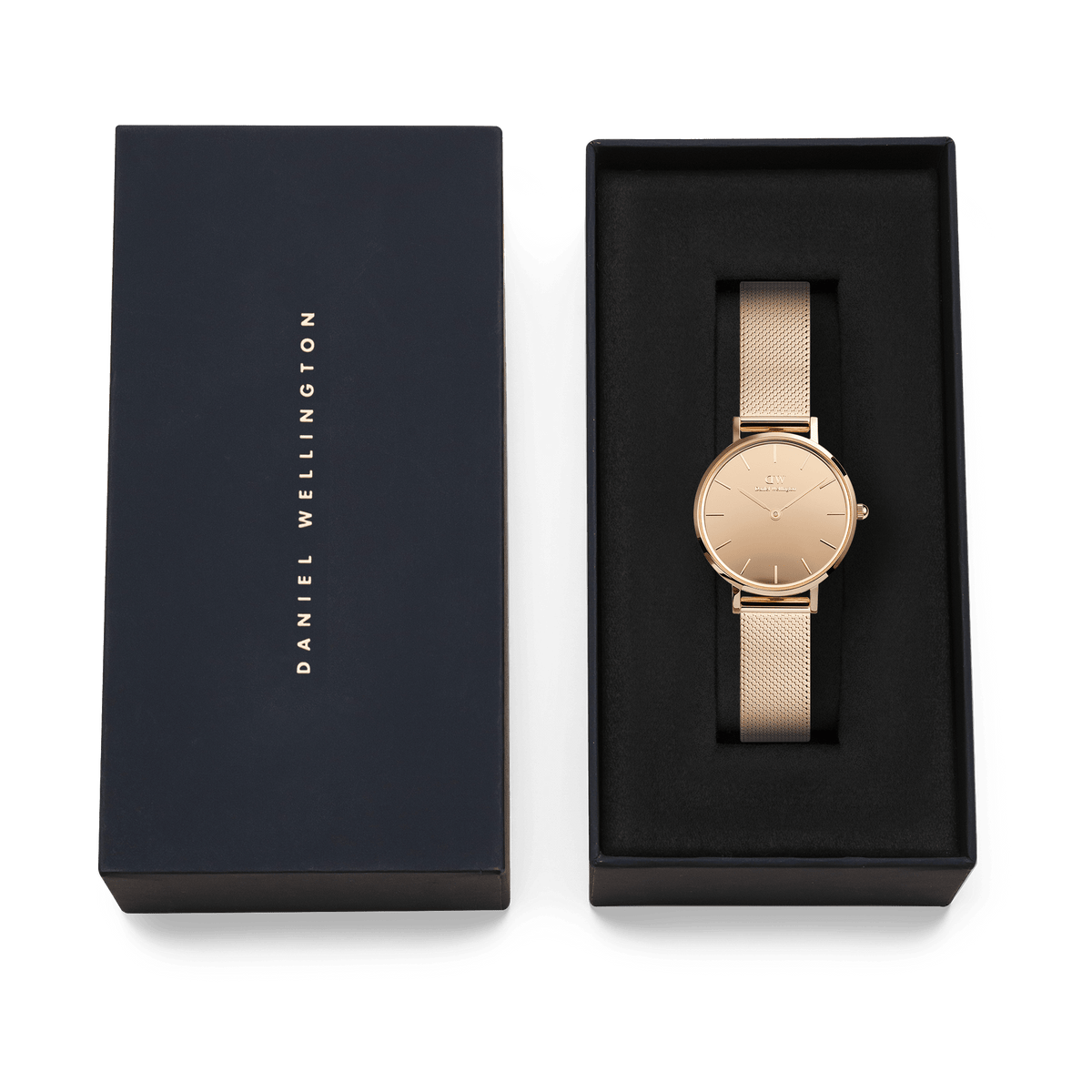 Petite Reflection Rose Gold women’s watch with a mirror glass dial and rose gold mesh strap, elegantly displayed in a black Daniel Wellington presentation box.