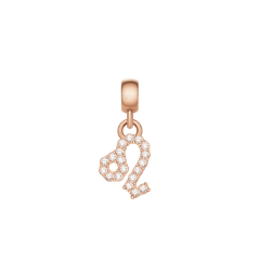 Rose gold zodiac charm featuring the Leo symbol, adorned with sparkling cubic zirconia crystals in a delicate claw setting.