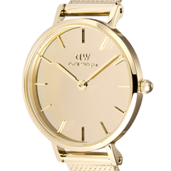 Close-up of Petite Reflection Gold watch featuring a mirror gold dial, minimalist markers, and polished gold case.