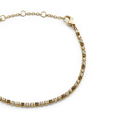 Classic Tennis Bracelet Honey Combo Gold featuring a slim gold chain with a row of honey-toned and clear Preciosa crystals, finished with an adjustable lobster clasp.