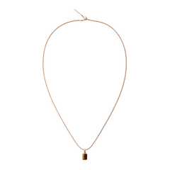 Rose gold necklace featuring an octagonal tiger eye charm with warm golden-brown tones, offering a modern and elegant accessory for everyday wear.