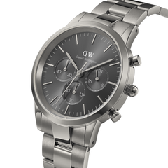 Daniel Wellington Iconic Chronograph Link Graphite watch with a brushed stainless steel bracelet, monochrome graphite sunray dial, and three sub-dials for chronograph functionality.