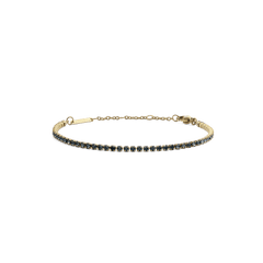 Delicate gold tennis bracelet featuring a row of individually set dark Preciosa crystals, finished with an adjustable chain and secure lobster clasp.