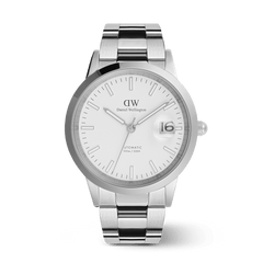 Daniel Wellington Iconic Link Automatic Silver watch featuring a polished stainless steel bracelet, white enamel dial, glow-in-the-dark markers, and a magnified date display.
