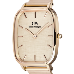 Close-up of the Daniel Wellington Marlon Wire Linen Rose Gold watch, highlighting its cushion-shaped rose gold case, linen-textured dial, minimalist hour markers, and slender hands.