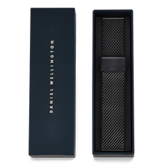 Onyx Mesh Strap presented in an elegant Daniel Wellington gift box, featuring a black stainless steel mesh design with a refined clasp, ideal for gifting or updating your watch.
