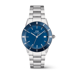 Men’s silver stainless steel watch with a deep blue enamel dial, anodised aluminium bezel, and three-link bracelet, featuring minimalist hour markers and a date display at 3 o’clock.