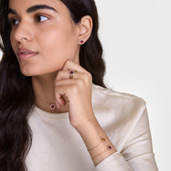 Woman wearing Audrey Ring Tiger Eye Rose Gold with matching jewellery, showcasing elegant rose gold and gemstone styling.