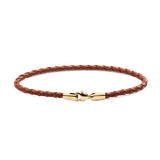 Slim braided brown leather bracelet featuring a polished gold-tone stainless steel lobster clasp, engraved with subtle branding for an elegant and versatile look.