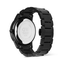 Rear view of the Daniel Wellington Iconic Paradigma Link Black watch, highlighting the engraved stainless steel case back and the polished black 3-link bracelet.