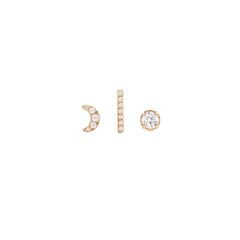 Set of three gold-plated earrings featuring a crescent moon, a vertical bar, and a round crystal stud, each adorned with sparkling crystals and designed for versatile, layered styling.