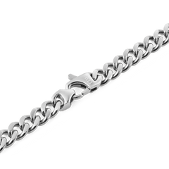 Detail of the Ellipse Cuban Chain Necklace Silver, showing the polished stainless steel Cuban links and the seamless transition to the matching lobster clasp.