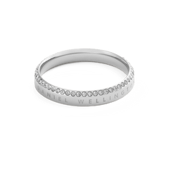 Classic Aura Ring Silver featuring a slim, polished stainless steel band with a row of sparkling white cubic zirconia crystals and subtle Daniel Wellington engraving along the edge.