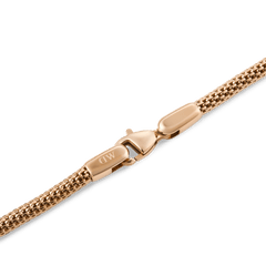 Close-up of the Tide Mesh Bracelet Melrose 2.8 showing its rose gold mesh chain and secure lobster clasp engraved with the Daniel Wellington logo.