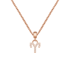 Rose gold Aries zodiac charm necklace featuring a crystal-encrusted pendant on a delicate chain.