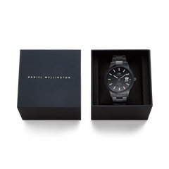 Daniel Wellington Iconic Link Automatic Black watch presented in a branded gift box, featuring a black enamel dial and stainless steel bracelet.