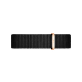 Cornwall Strap Rose Gold features a woven black polyester NATO watch strap with a polished rose gold loop, offering a modern and elegant accent for Daniel Wellington timepieces.