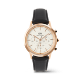 Daniel Wellington Iconic Chronograph Sheffield RG men’s watch with a white minimalist dial, rose gold case, three sub-dials, and a black leather strap.