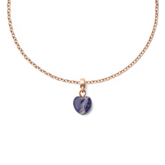 Rose gold chain necklace featuring a heart-shaped blue spot stone charm with natural veining, offering a refined and elegant jewellery accent.