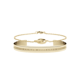 Gold Daniel Wellington bracelet set featuring a sleek engraved cuff and a delicate chain bracelet, both finished in polished gold with subtle branding for an elegant, timeless look.