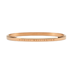 Slim rose gold bangle crafted from polished stainless steel, featuring a minimalist design with subtle Daniel Wellington engraving along the outer edge.