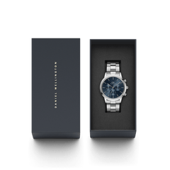 Iconic Chronograph Arctic S watch with a blue sunray dial and silver stainless steel bracelet, elegantly presented in a dark Daniel Wellington gift box.
