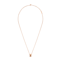 Rose gold Elevation Necklace with a geometric sculpted pendant on a fine adjustable chain, shown laid flat against a white background.