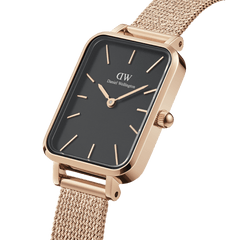 Close-up of the Quadro Pressed Melrose Black Rose Gold watch showing its rectangular black dial, minimalist rose gold markers, and elegant rose gold mesh strap.