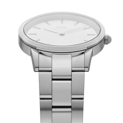 Close-up of Daniel Wellington Iconic Link Silver watch showing polished stainless steel bracelet and minimalist white dial.