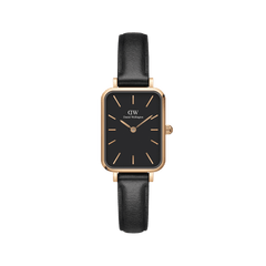 Rectangular women’s watch with a black dial, rose gold case and markers, and a slim black leather strap.