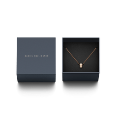 Elan Lumine Necklace Rose Gold displayed in an elegant Daniel Wellington gift box, featuring a rose gold cable chain and a crystal-set barrel pendant.